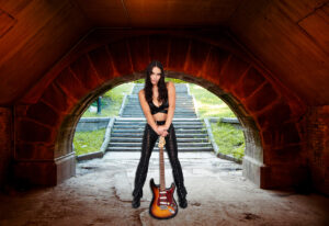 Musician with a guitar in the park